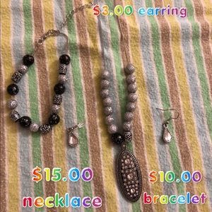 Black and silver necklace, bracelet and earrings